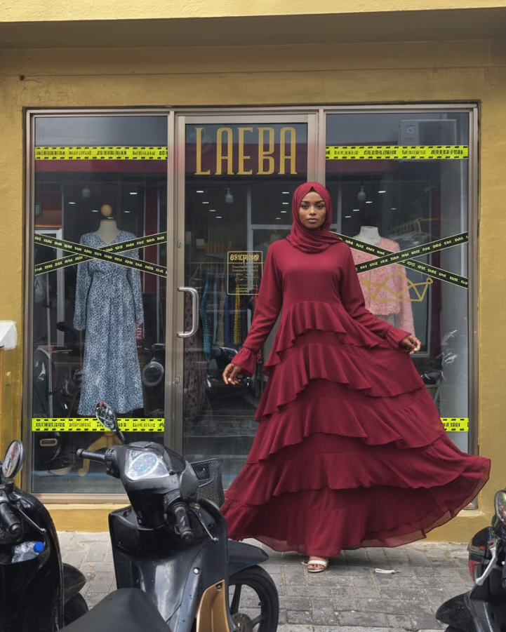 Hyperrealistic dark-skinned model in wine red dress at Laeba